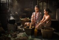 Ilustrasi seorang nenek yang sedang mendongeng kepada anak-anak kecil, menggambarkan tradisi lisan yang kaya akan kisah rakyat di berbagai pelosok Nusantara. Suasana hangat dan penuh imajinasi terpancar dari ekspresi wajah mereka, menunjukkan betapa pentingnya transfer cerita dari generasi ke generasi.